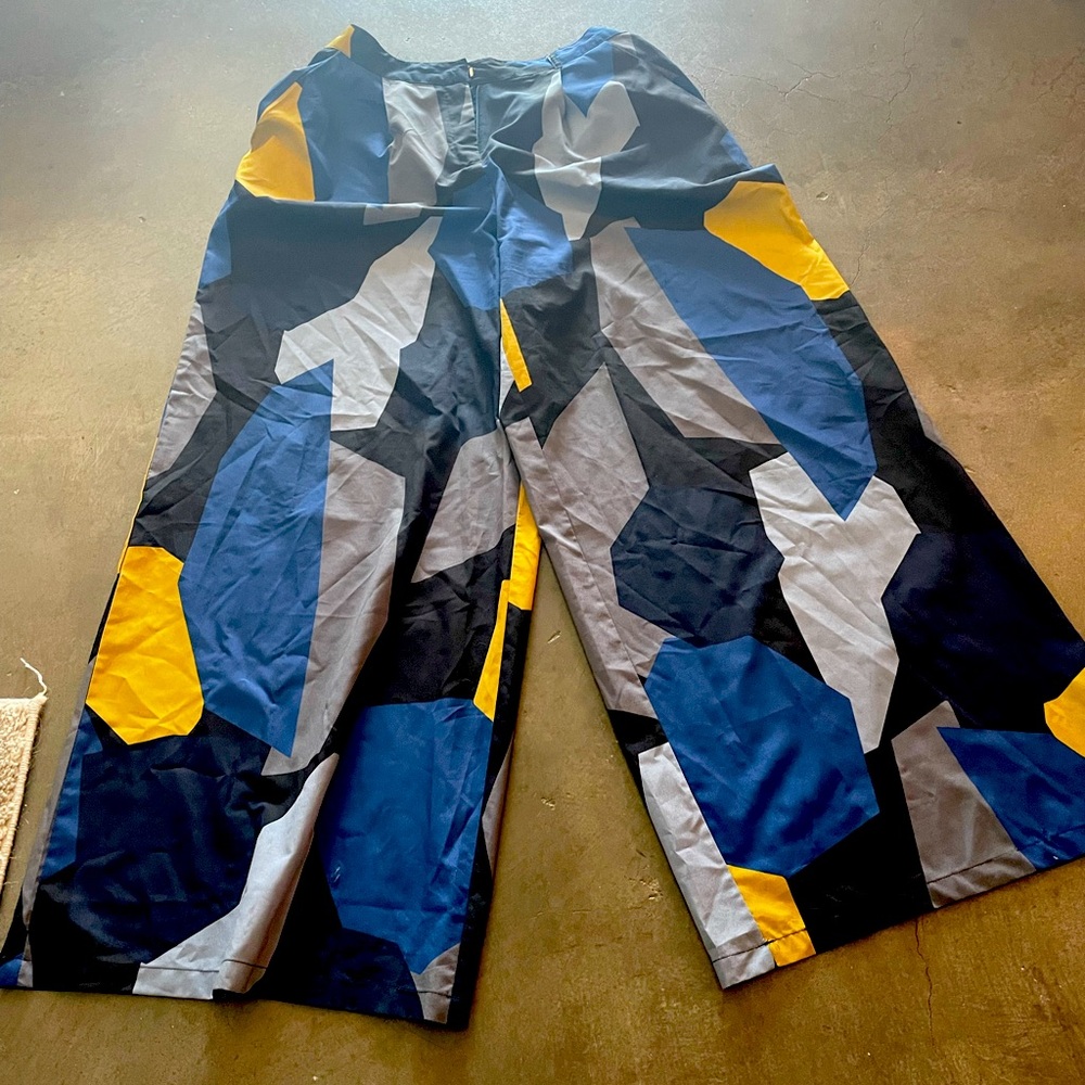Yellow and blue high waisted, flare, patterned dress pants.